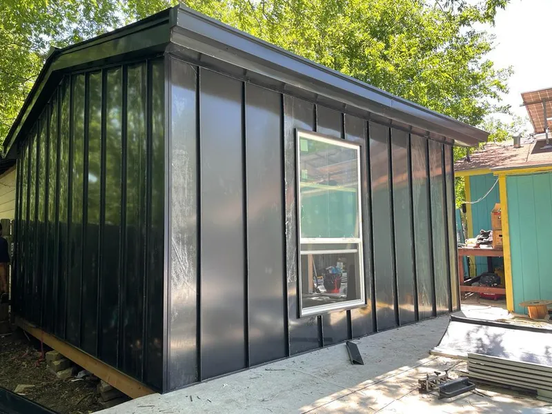 Black standing seam metal wall panels for Metal Roof Installation in Orono